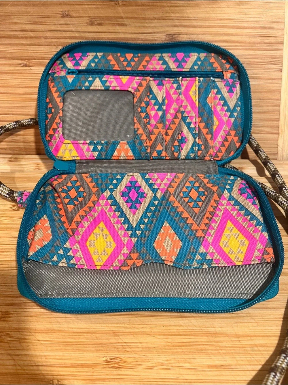 KAVU Go Time Bi-Fold Crossbody Wallet in a colorful geometric print